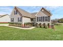 Well maintained property with a pristine lawn and mature plantings at 332 Shiloh S Rd, York, SC 29745