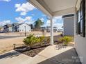 Front porch with shrubs and a view of a residential street at 6351 Trinity Crossing Cir, Kannapolis, NC 28081