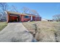 Ranch home with carport and long driveway at 720 Pleasant Ave, Kannapolis, NC 28081