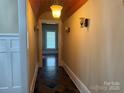 Inviting hallway with tiled floor, wooden ceiling and stylish sconces at 135 Waycross Dr, Rockwell, NC 28138