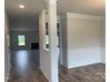 Bright entryway with hardwood floors and views into the living room and dining area at 156 Swann Rd # 7, Statesville, NC 28625