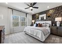 Spacious main bedroom with large windows and stylish decor at 2320 Donnelly Hills Ln, Charlotte, NC 28262