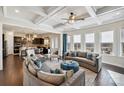 Spacious living room featuring elegant furnishings, coffered ceilings, and an open layout to the kitchen at 4027 Wiltshire Ln, Indian Land, SC 29707