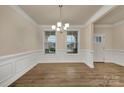 This dining room features hardwood floors, large windows, and crown molding at 4849 Tacoma Dr, Fort Mill, SC 29707