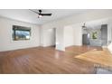 Spacious living area with hardwood floors and an open layout into the kitchen at 49 8Th Se St, Hickory, NC 28602