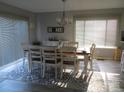 Bright dining room with large windows and a modern chandelier at 8188 Normandy Rd, Denver, NC 28037