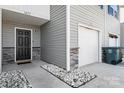 Stylish entrance with gray siding, stone accents, black front door, and white rock landscaping at 1475 Cypress Loop # 29, Newton, NC 28658