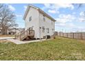 This home boasts a spacious backyard, complete with a cozy deck, ample green space, and a well-maintained fence at 305 Wingate Ct, Shelby, NC 28152