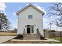 Inviting two-story home with a charming front entrance, featuring white siding and a well-maintained wooden staircase at 305 Wingate Ct, Shelby, NC 28152