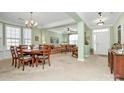 Bright dining room with hardwood floors and a charming chandelier at 3229 Sapphire Ln, Fort Mill, SC 29708