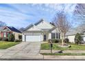 House exterior featuring a two-car garage and manicured landscaping at 3229 Sapphire Ln, Fort Mill, SC 29708