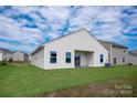 New home with a spacious backyard, a covered patio, and a well-maintained lawn at 3238 Maple Ridge Dr, Gastonia, NC 28052