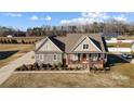 Lovely home showing landscaping, spacious lot, long driveway, and a covered front porch at 1025 Coppergate Dr, Salisbury, NC 28147
