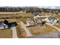 This aerial view showcases this home's spacious lot and a long driveway at 1025 Coppergate Dr, Salisbury, NC 28147