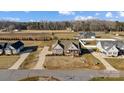 Aerial view of lovely home, showing landscaping, spacious lot, and long driveway at 1025 Coppergate Dr, Salisbury, NC 28147