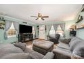 Cozy living room with a ceiling fan, windows, and comfortable seating arrangement at 1098 20Th Ne St, Hickory, NC 28601