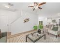 Bright living room with stylish decor, hardwood floors, modern furnishings, and an inviting open layout at 1116 Thayer Glen Ct, Charlotte, NC 28213