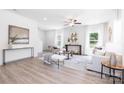 Bright living room with neutral tones, stylish decor, modern furniture, and lots of natural light at 1124 Thayer Glen Ct, Charlotte, NC 28213