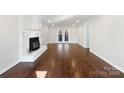 Bright living room featuring hardwood floors and fireplace at 11430 Gelding Dr, Charlotte, NC 28215