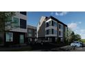 Modern townhomes with sleek gray and black exterior, stylish architecture, and ample parking at 115 Verbena Ne St # 12, Charlotte, NC 28217