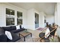 Relaxing front porch with comfortable seating at 13109 Brooklyn Skylar Way, Huntersville, NC 28078