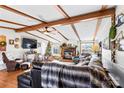 Living room with exposed beams, fireplace, and comfy seating at 1789 Paris Dr, Conover, NC 28613