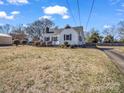 White house with black shutters and a large front yard at 201 Ware St, Shelby, NC 28150