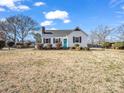 White house with black shutters and a spacious front yard at 201 Ware St, Shelby, NC 28150
