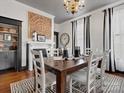 Elegant dining room featuring a beautiful wood table, decorative fireplace, and stylish accents at 331 E White St, Rock Hill, SC 29730