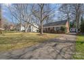 Lovely brick home with mature trees, long driveway and inviting curb appeal in a desirable location at 4001 Glenfall Ave, Charlotte, NC 28210