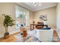 Bright home office with hardwood floors, a large window, and stylish furniture at 4114 Thames River Pl, Harrisburg, NC 28075