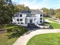 Expansive property with a luxurious home and beautifully landscaped grounds at 4129 Carnoustie Ln, Charlotte, NC 28210