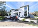 Modern home showcasing a stylish facade and manicured landscaping at 4129 Carnoustie Ln, Charlotte, NC 28210
