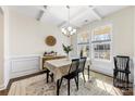 Bright dining room featuring a stylish chandelier, hardwood floors, and large windows at 4866 Breden St, Kannapolis, NC 28081