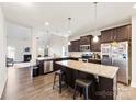 Open kitchen with granite countertops, stainless steel appliances, and a spacious island at 4866 Breden St, Kannapolis, NC 28081