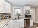 Kitchen view featuring stainless steel appliances, granite countertops, and stylish white cabinetry at 7514 Highway 205 Hwy, Marshville, NC 28103