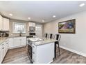 Well-lit kitchen featuring white cabinets, granite countertops, and stainless steel appliances at 7514 Highway 205 Hwy, Marshville, NC 28103