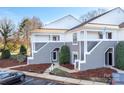 Charming townhome with stylish gray and white exterior, featuring covered entryways at 753 Southwest Dr, Davidson, NC 28036