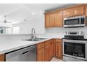 Kitchen with stainless steel appliances and wood cabinets at 753 Southwest Dr, Davidson, NC 28036