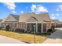 Ranch style home with screened porch, brick exterior at 8466 Benton Ct, Denver, NC 28037