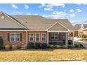 Brick home with screened porch and mature shrubs at 8466 Benton Ct, Denver, NC 28037