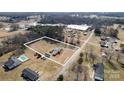 Spacious parcel with home, multiple outbuildings, and mature trees near local amenities at 87 Firemens Ln, Taylorsville, NC 28681