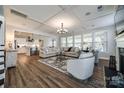 Spacious living room featuring a modern fireplace, coffered ceilings, and an open floor plan at 1235 Fishing Creek Rd, Clover, SC 29710