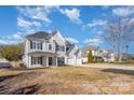 Inviting two-story home with a three-car garage, lovely curb appeal in established neighborhood at 132 Elizabeth Hearth Rd, Mooresville, NC 28115