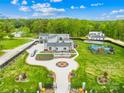Sprawling estate featuring a contemporary home, playground, and manicured grounds, creating a private oasis for comfortable living at 15700 Youngblood Rd, Charlotte, NC 28278