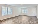 Bright living room with hardwood floors and neutral walls at 1715 Wooten Way, Bessemer City, NC 28016