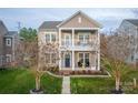 Charming two-story home with a welcoming front porch and second story balcony, perfect for enjoying the outdoors at 375 Montibello Dr, Mooresville, NC 28117