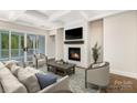 Living room featuring a fireplace, hardwood floors and ample seating at 4021 Harmattan Dr, Denver, NC 28037
