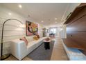 Open living area featuring a sectional sofa and built-in shelving at 8016 Lerwick Trl, Charlotte, NC 28269
