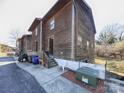 Exterior view of the apartment building showing wood siding and landscaping at 813 Alexander St, Statesville, NC 28677